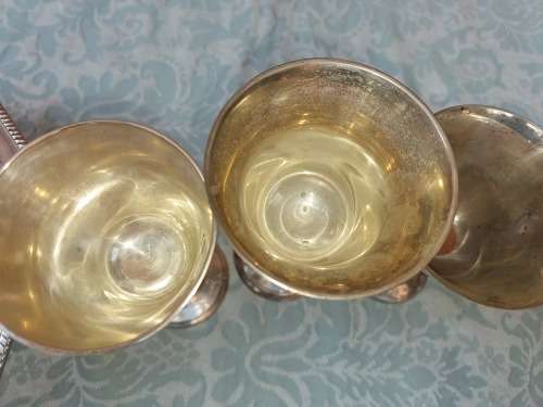 A MIXED VINTAGE JOB LOT WINE FLUTES AND A SERVING BOWL ALL SILVER PLATED SOLD AS IS