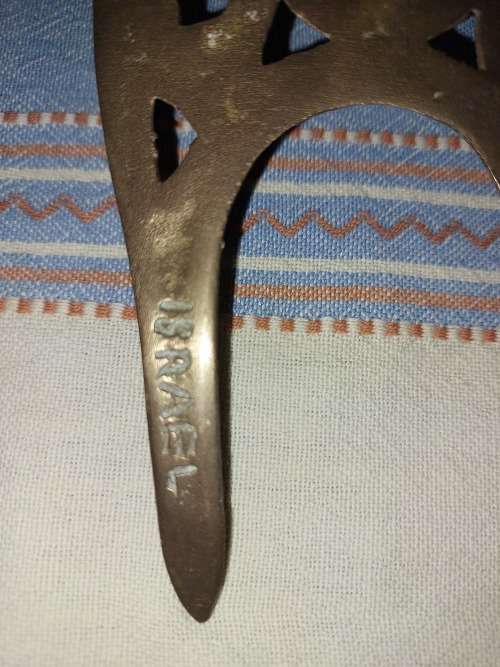A SET OF ORNAMENTAL BRASS LADEL AND FORK MADE IN ISREAL LENGTH 35 TO 40 CENTIMETERS SOLD AS IS