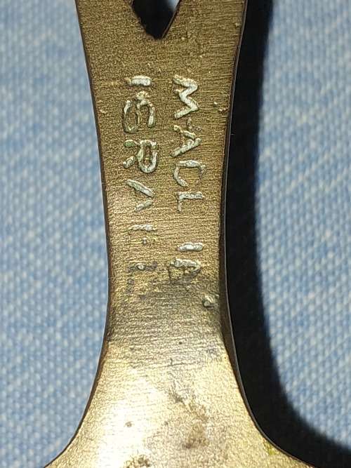 A SET OF ORNAMENTAL BRASS LADEL AND FORK MADE IN ISREAL LENGTH 35 TO 40 CENTIMETERS SOLD AS IS