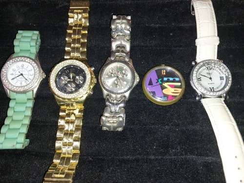 A COLLECTION OF FASHION DRESS WATCHES SOLD AS IS NOT TESTED