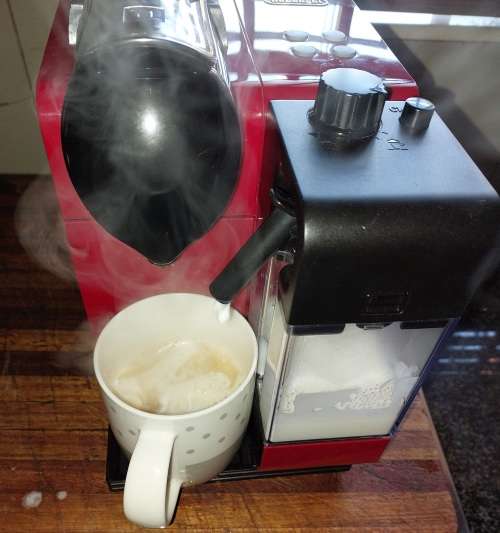 A USED IN PERFECT CONDITION DELINGI TREVISO ITALIA TYPE EN520.R COFFEE MACHINE MADE IN ITALY RED IN