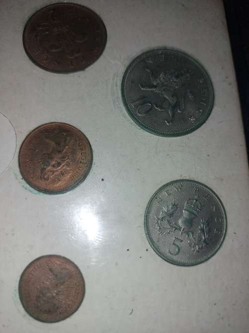 AN ANTIQUE COLLECTION OF BRITISH COINS SOLD AS IS
