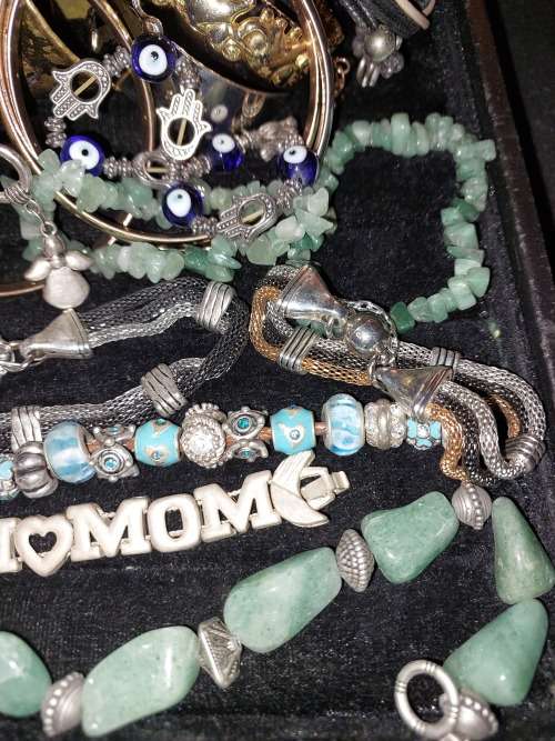 A BULK JOBLOT ANTIQUE AND VINTAGE BANGLES AND BRACELETS SOLD AS IS