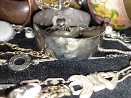 A BULK JOBLOT ANTIQUE AND VINTAGE BANGLES AND BRACELETS SOLD AS IS