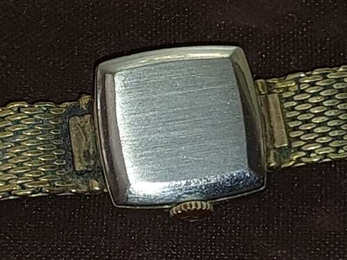 AN ANTIQUE TISSOT SAPHIR GOLD PLATED WITH THE CRYSTAL GLASS SOLD AS IS NOT TESTED