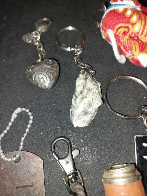 A BULK COLLECTION KEYRINGS AND CELLPHONE CHARMS SOLD AS IS