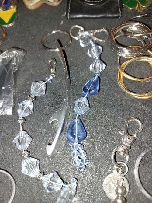 A BULK COLLECTION KEYRINGS AND CELLPHONE CHARMS SOLD AS IS
