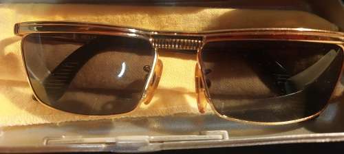 A COLLECTION OF POLICE VERSACE AND BVLGARI SPECTACLES SOLD AS IS