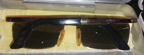 A COLLECTION OF POLICE VERSACE AND BVLGARI SPECTACLES SOLD AS IS