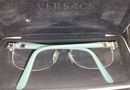 A COLLECTION OF POLICE VERSACE AND BVLGARI SPECTACLES SOLD AS IS