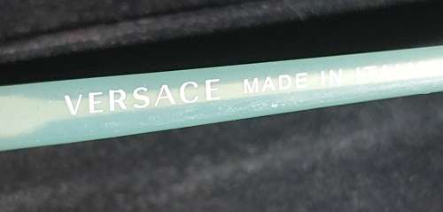 A COLLECTION OF POLICE VERSACE AND BVLGARI SPECTACLES SOLD AS IS