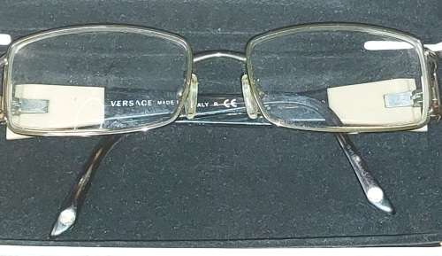 A COLLECTION OF POLICE VERSACE AND BVLGARI SPECTACLES SOLD AS IS