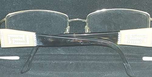A COLLECTION OF POLICE VERSACE AND BVLGARI SPECTACLES SOLD AS IS