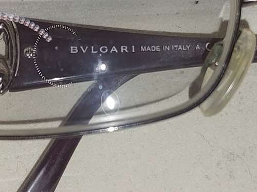 A COLLECTION OF POLICE VERSACE AND BVLGARI SPECTACLES SOLD AS IS