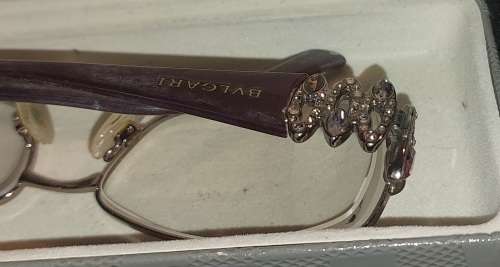 A COLLECTION OF POLICE VERSACE AND BVLGARI SPECTACLES SOLD AS IS