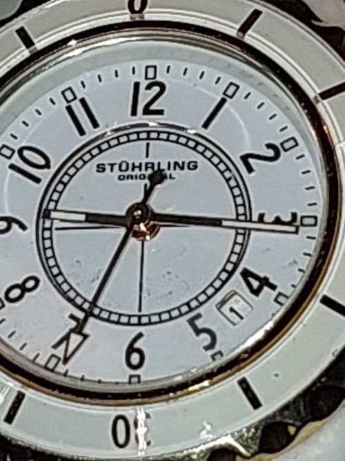 A RARE STRUHRLING ORIGINAL WHITE CERAMIC AND SAFFIRE CRYSTAL WRIST WATCH