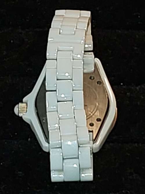 A RARE STRUHRLING ORIGINAL WHITE CERAMIC AND SAFFIRE CRYSTAL WRIST WATCH