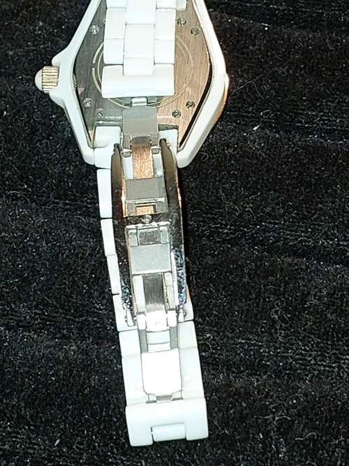 A RARE STRUHRLING ORIGINAL WHITE CERAMIC AND SAFFIRE CRYSTAL WRIST WATCH