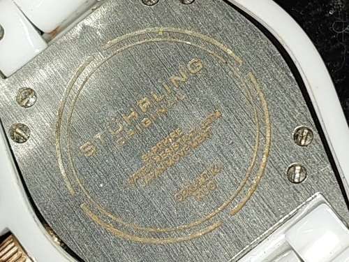 A RARE STRUHRLING ORIGINAL WHITE CERAMIC AND SAFFIRE CRYSTAL WRIST WATCH