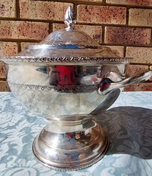 A VINTAGE SERANCO SILVERPLATED ON COPPER TURINE SOLD AS IS