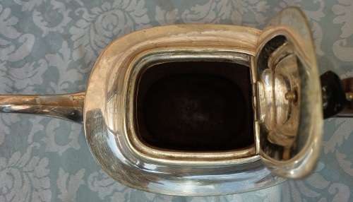 AN ANTIQUE EPNS SHEFFIELD TEAPOT WITH A TEAK HANDLE