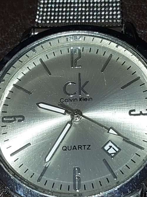 TWO CK SILVER PLATED WRIST WATCHES SOLD AS IS NOT TESTED