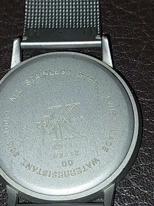 TWO CK SILVER PLATED WRIST WATCHES SOLD AS IS NOT TESTED