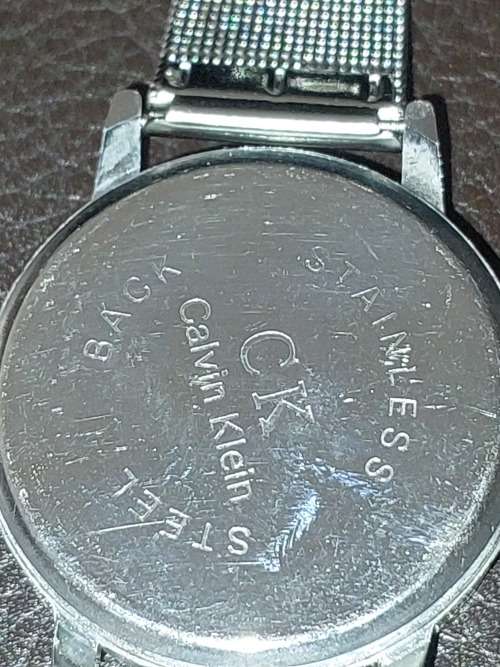 TWO CK SILVER PLATED WRIST WATCHES SOLD AS IS NOT TESTED