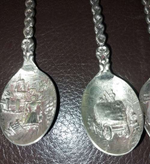 A SET OF VINTAGE DELF COLLECTORS TEASPOON SET SOLD AS IS