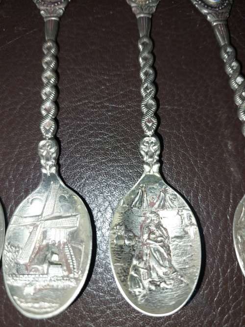 A SET OF VINTAGE DELF COLLECTORS TEASPOON SET SOLD AS IS
