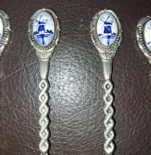 A SET OF VINTAGE DELF COLLECTORS TEASPOON SET SOLD AS IS