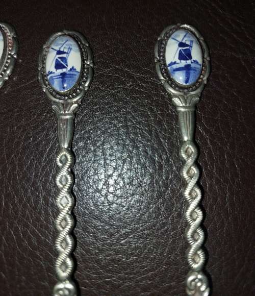 A SET OF VINTAGE DELF COLLECTORS TEASPOON SET SOLD AS IS