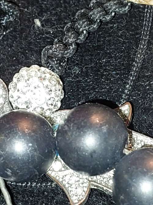 A COLLECTION OF VINTAGE COSTUME BRACELETS AND BANGLES SOLD AS IS