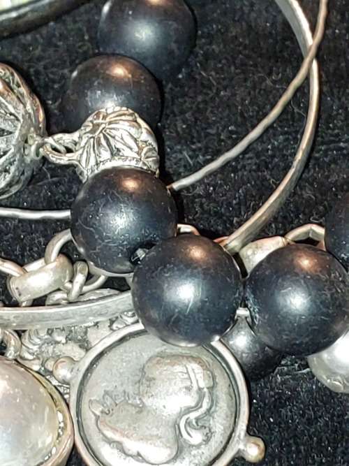 A COLLECTION OF VINTAGE COSTUME BRACELETS AND BANGLES SOLD AS IS