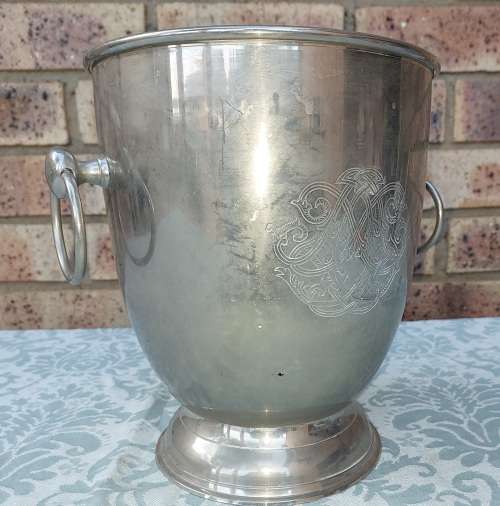 A VINTAGE SILVER PLATED ON BRONZE ICE BUCKET WITH HANDLES