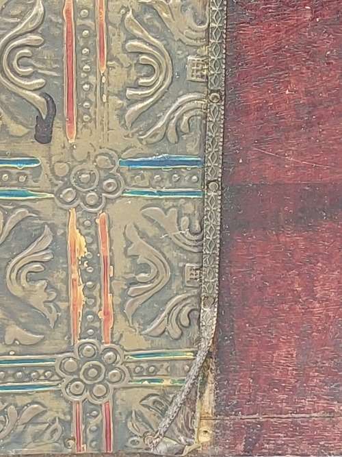 AN ANTIQUE WOODEN CHEST WITH INTRICATE BRONZE WORK