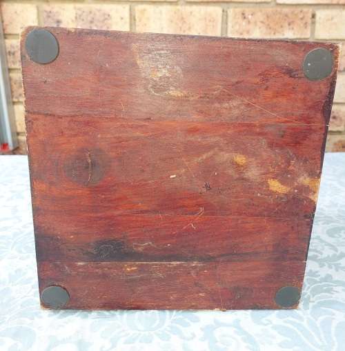 AN ANTIQUE WOODEN CHEST WITH INTRICATE BRONZE WORK
