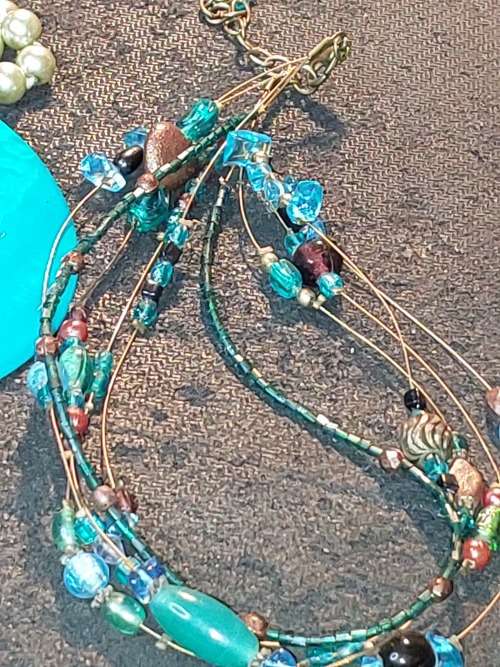 A COLLECTION OF VINTAGE TURQUOISE AND OTHER COSTUME NECKLACES SOLD AS IS