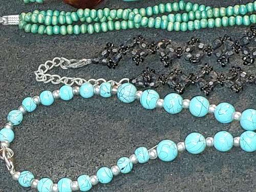 A COLLECTION OF VINTAGE TURQUOISE AND OTHER COSTUME NECKLACES SOLD AS IS