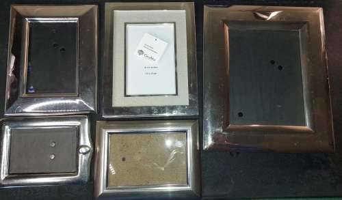 A COLLECTION OF STAINLESS STEEL CHROME PHOTI FRAMES