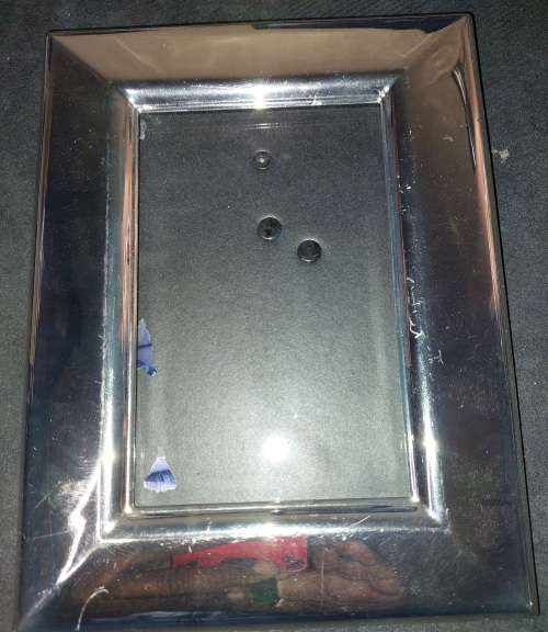 A COLLECTION OF STAINLESS STEEL CHROME PHOTI FRAMES