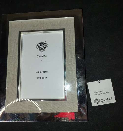 A COLLECTION OF STAINLESS STEEL CHROME PHOTI FRAMES