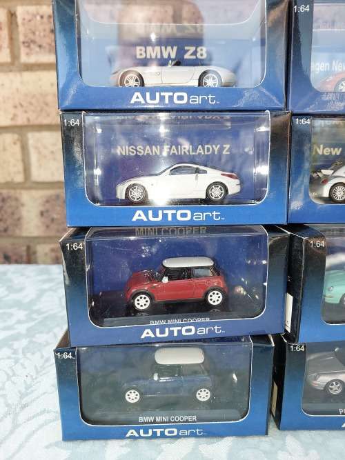 A COLLECTION OF 24 AUTO ART ADULT COLLECTORS EDITION DIECAST CARS IN MINT CONDITION SOLD AS IS