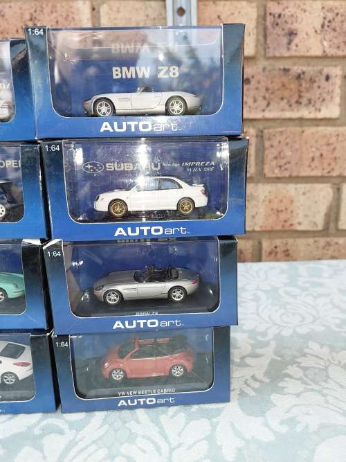 A COLLECTION OF 24 AUTO ART ADULT COLLECTORS EDITION DIECAST CARS IN MINT CONDITION SOLD AS IS