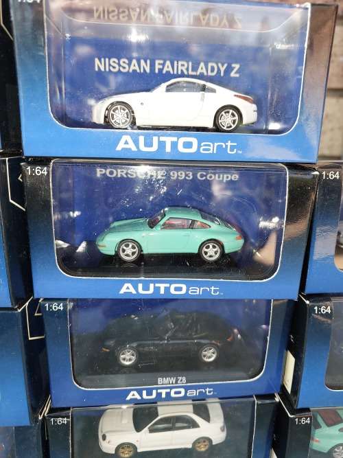 A COLLECTION OF 24 AUTO ART ADULT COLLECTORS EDITION DIECAST CARS IN MINT CONDITION SOLD AS IS