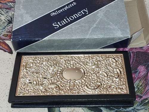 A SILVER-PLATED VINTAGE ADDRESS AND TELEPHONE BOOK