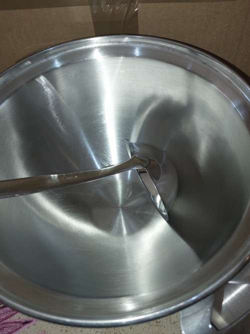 A VINTAGE STAINLESS STEEL SOUP TURINE WITH A LADEL
