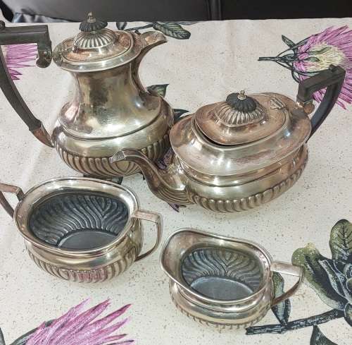 AN ANTIQUE EPNS TEA JUG SET SOLD AS IS