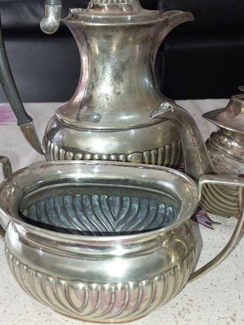 AN ANTIQUE EPNS TEA JUG SET SOLD AS IS
