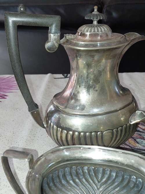 AN ANTIQUE EPNS TEA JUG SET SOLD AS IS